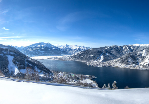 Snow-covered winter landscape with a breathtaking view at Lake Zell / Kaprun