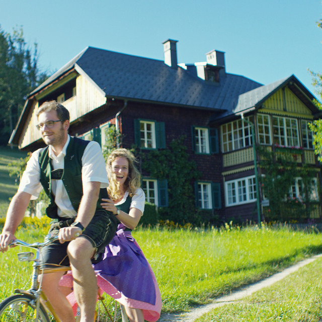 Biking in traditional costume 