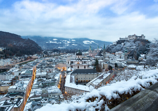 The fortress Hohensalzburg thrones over the snow covered city of Salzburg